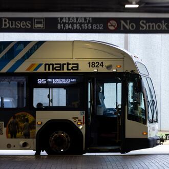 A bus driver waits at the West End MARTA station in Atlanta in September 2025. (Arvin Temkar/AJC)