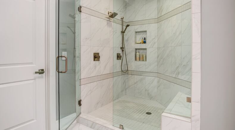 Spacious showers with niches and benches are replacing traditional bathtubs. Contributed by FrontDoor Communities
