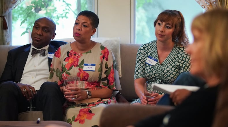 Mawuli Davis, Jana Johnson-Davis, and Monica Agoston listen as actor Jay Jones reads a short script centered on race as part of Decatur Dinners at the home of Clare and Jay Schexnyder on Sunday, Aug. 25, 2019, in Decatur. The reading and dinner was one of 100 being held simultaneously across Decatur to talk about race and equity. (Elijah Nouvelage for The Atlanta Journal-Constitution)