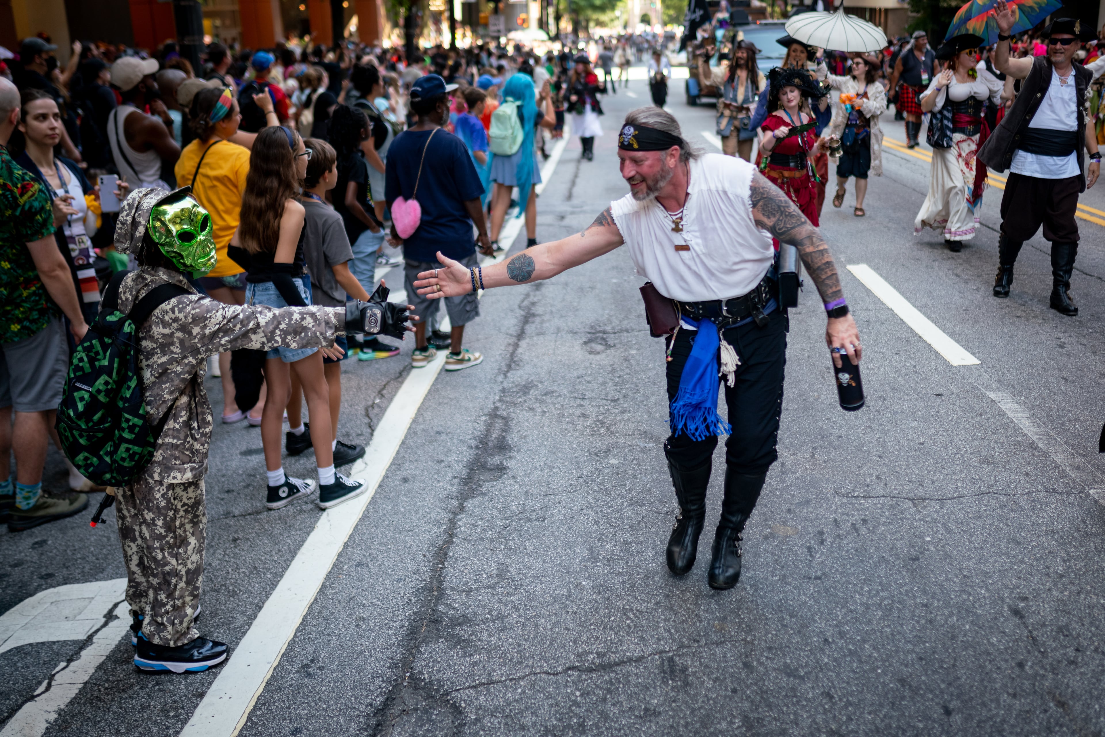 Thousands lined up along Peachtree Street on Saturday morning, August 31, 2024, for the annual Dragon Con parade in Atlanta. (Ben Hendren for The Atlanta Journal-Constitution)
