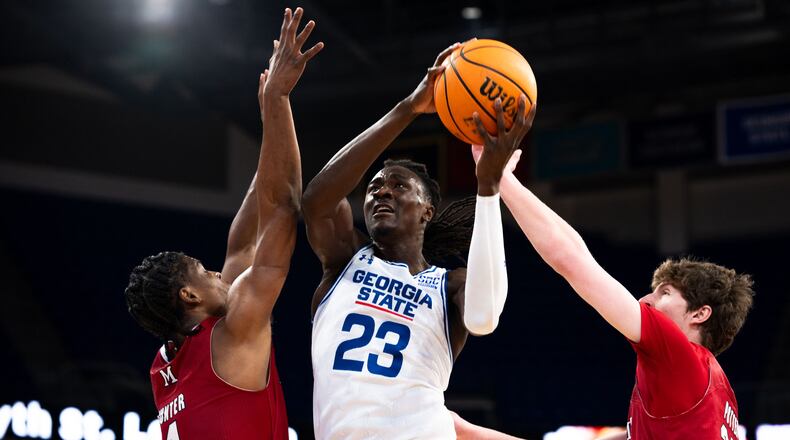 Georgia State's Leslie Nkereuwem powers his way past two defenders to score against Miami (Ohio), Feb. 10, 2024. Nkereuwem scored 14 points on 6-for-8 shooting. (Jett Parker/Georgia State Athletics)