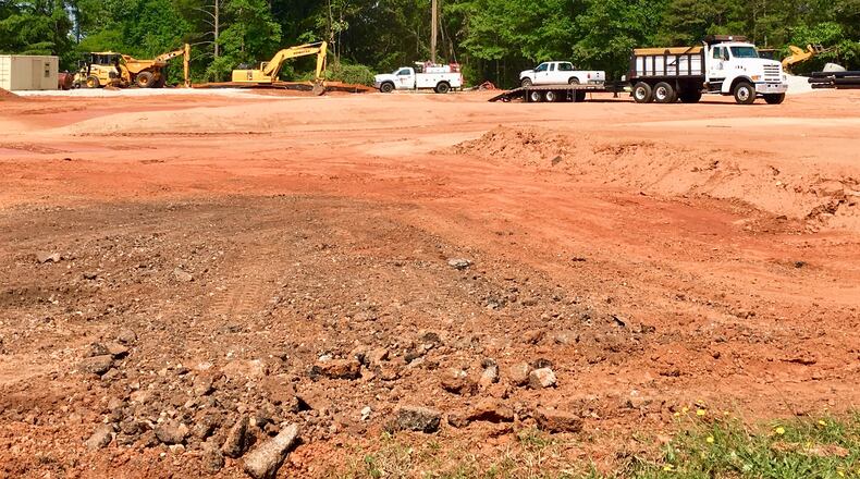 A portion of the triangle bordered by the Atlanta-Stone Mountain PATH (distant background), Wells Street and Hobbs Street where construction of a 33-townhome development in north Avondale Estates will begin this fall. Bill Banks for the AJC