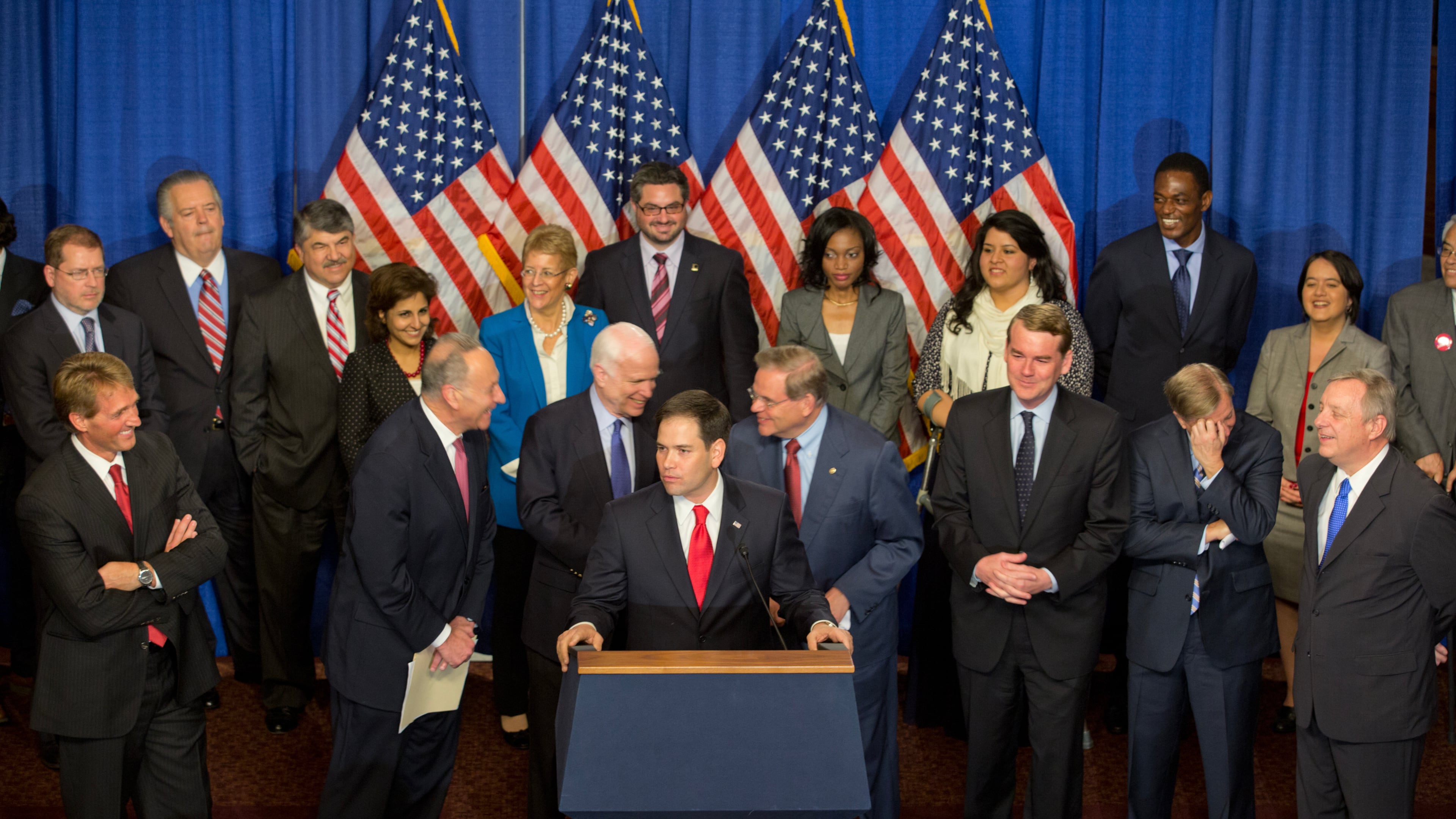 The bipartisan “Gang of Eight”, from left; Sen. Charles Schumer (D-N.Y.), Sen. John McCain (R-Ariz.), Sen. Marco Rubio (R-Fla.), at lectern, Sen. Robert Menendez (D-N.J.), Sen. Michael Bennet (D-Colo.), Sen. Lindsey Graham (R-S.C.), and Sen. Dick Durbin (D-Ill.), announce the 1,200-page Border Security, Economic Opportunity, and Immigration Modernization Act of 2013, at the Capitol in Washington on April 18, 2013. In contrast to 2007, the bill cleared the Senate with surprising strength, attracting 68 votes, including 14 Republicans and all Democrats. (Stephen Crowley/The New York Times)