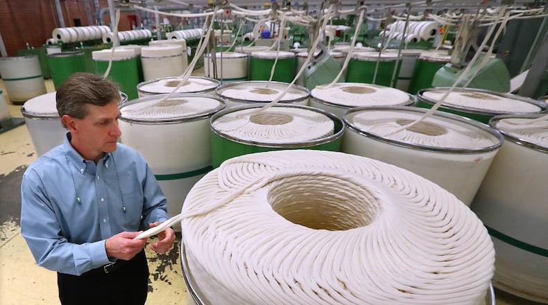 Buhler Yarns CEO Marty Moran looks over slivers used to spin yarn during a tour of his company on Monday, March 11, 2019, in Jefferson. Curtis Compton/ccompton@ajc.com