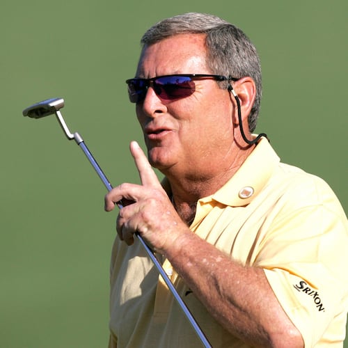 FILE - In this April 6, 2006, file photo, Fuzzy Zoeller encourages the crowd to be quiet on the second hole during first round play at the Masters golf tournament at the Augusta National Golf Club in Augusta, Ga. (AP Photo/Morry Gash, File)