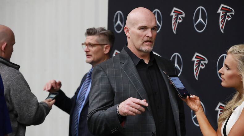 April 26, 2019 Flowery Branch: The Atlanta Falcons head coach Dan Quinn and general manager Thomas Dimitroff discuss their first-round draft picks with the media at the team indoor practice facility on Friday, April 26, 2019, in Flowery Branch. Curtis Compton/ccompton@ajc.com