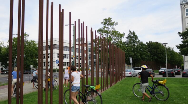 Sticks now mark the path of the Berlin Wall, which fell almost 26 years ago. (Michaela Urban/Chicago Tribune/TNS)