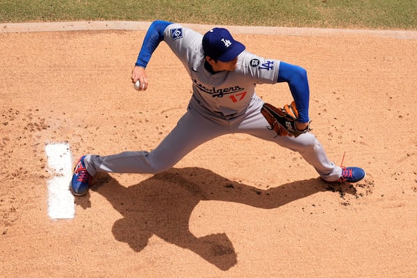 Los Angeles Dodgers starting pitcher Shohei Ohtani warms up before a baseball game against the Kansas City Royals, Saturday, June 28, 2025, in Kansas City, Mo. (AP Photo/Charlie Riedel)