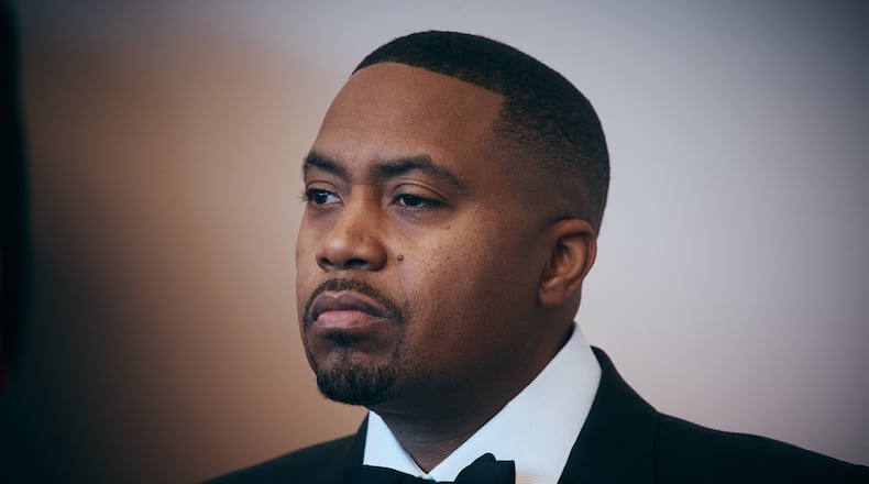 FILE - Rapper Nas listens to a speaker during the opening of live table games at Resorts World New York City on April 28, 2026, in New York. (AP Photo/Andres Kudacki, File)