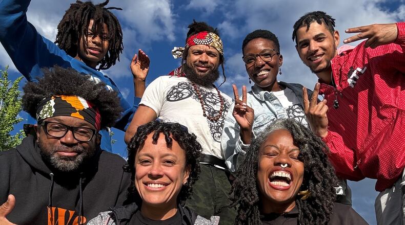 Members of the Black cycling collective Red, Bike and Green pose on a sunny day in Atlanta. Front row (L to R): Sylvester Price, Tasha Gomes, Zahra Alabanza. Back row (R to L): Chad Park, Kimerie Swift, Kenneth Florence Jr., and Marley Alabanza.