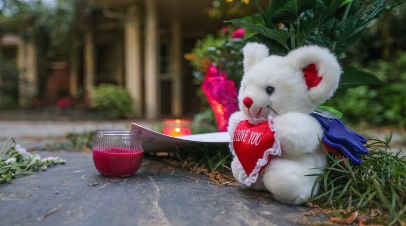 A memorial for Barney Simms is placed in front of his home. The prominent civic leader was shot and killed in his southwest Atlanta front yard Saturday afternoon, police said.
