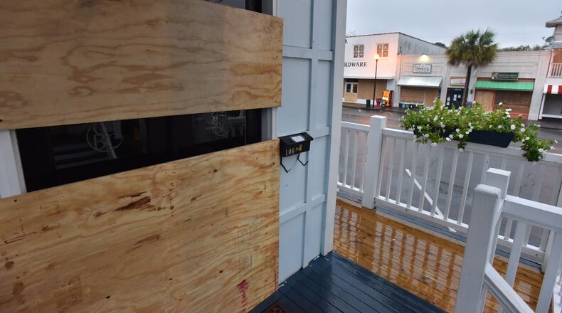 Stores are boarded up ahead of Hurricane Matthew at Pier Village in St. Simons Island on Friday morning, October 7, 2016.
