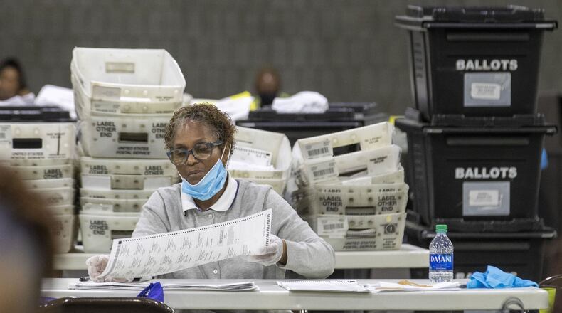 Fulton County employees continue to count mail-in ballots the day after the Georgia primary election at the Georgia World Congress Center in Atlanta, Wednesday, June 10, 2020. A spokesperson for Fulton County said that they will announce the final number of mail-in ballots on Wednesday. (ALYSSA POINTER / ALYSSA.POINTER@AJC.COM)