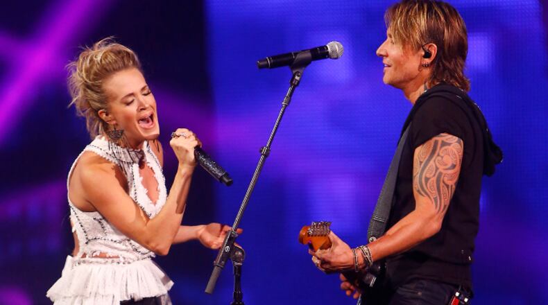Carrie Underwood, left, and Keith Urban perform "The Fighter" at the CMT Music Awards at Music City Center on Wednesday, June 7, 2017, in Nashville, Tenn. (Photo by Wade Payne/Invision/AP)