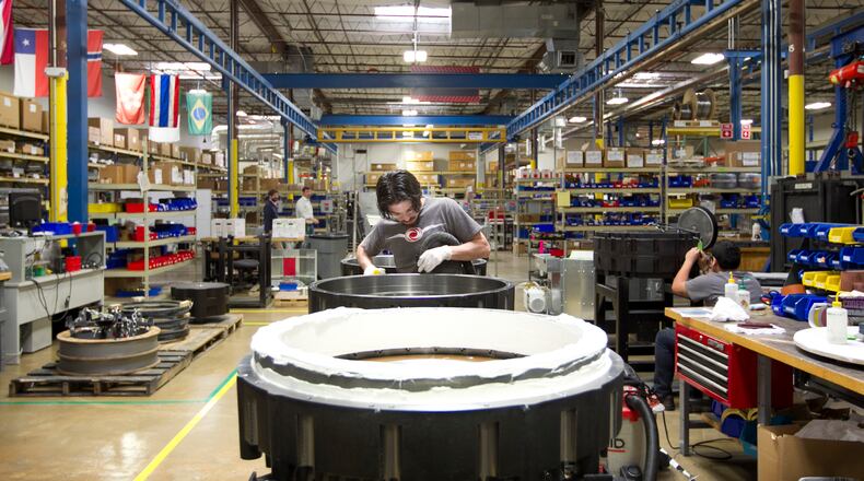 Manufacturing assembler John Cartwright prepares the flywheel housing for Active Powers flywheel based UPS (uninterruptible power supply) product which the company brands CleanSource UPS at Active Power on Wednesday April 16, 2014. JAY JANNER / AMERICAN-STATESMAN