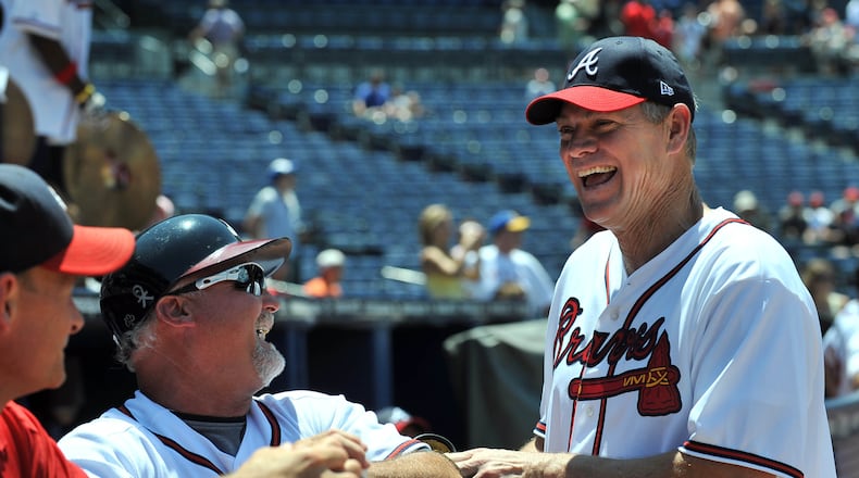 100626 Atlanta : Murphy's MVP's captain Dale Murphy (right) and Braves coach Glee Hubbard share a laugh during the Celebrity-Alumni Softball Classic at Turner Field. The Atlanta Braves hosts their first Celebrity-Alumni Softball Classic before the Braves take on the Detoit Tigers on Saturday at Turner Field in Atlatan. Saturday, June 26, 2010 Hyosub Shin hshin@ajc.com Dale Murphy remains a popular figure at Braves games (Hyosub Shin/AJC)