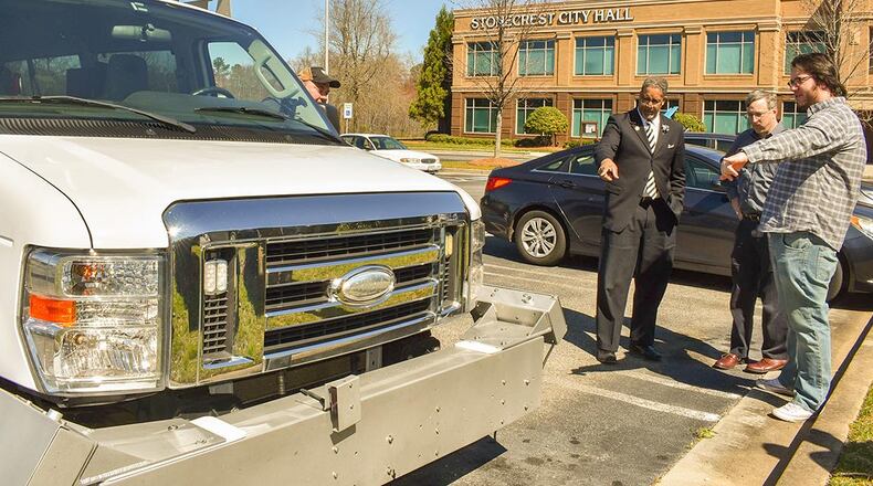 Stantec Consulting Services Inc. used trucks to analyze the condition of Stonecrest's roads. Mayor Jason Lary (left) said a report based on the analysis is expected soon.