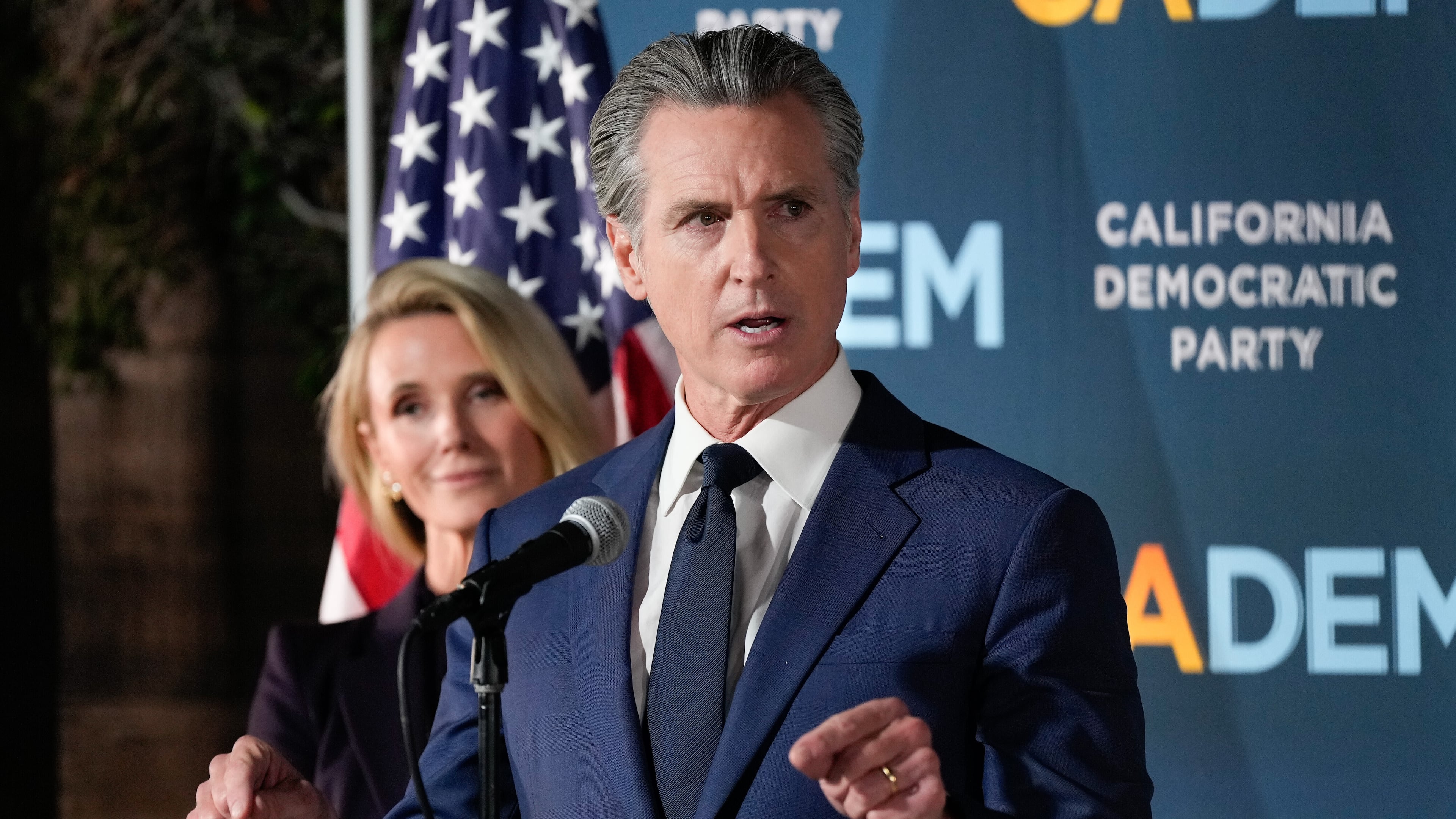 California Gov. Gavin Newsom speaks as he stands with first partner Jennifer Siebel Newsom during an election night press conference at a California Democratic Party office Tuesday, Nov. 4, 2025, in Sacramento, Calif. (AP Photo/Godofredo A. Vásquez)
