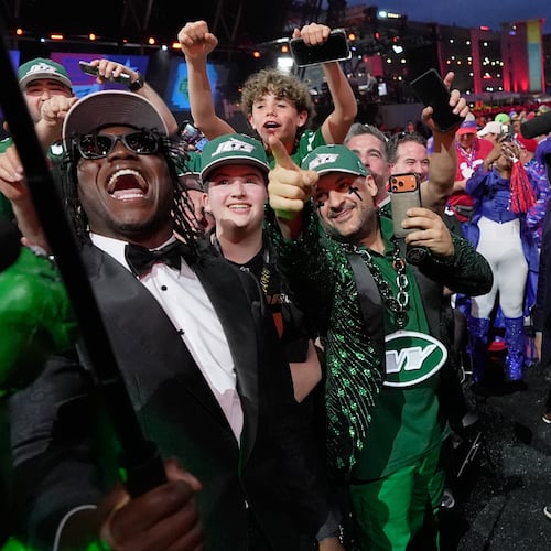 Texas Tech linebacker David Bailey poses with fans after being chosen by the New York Jets with the second overall pick during the first round of the NFL football draft, Thursday, April 23, 2026, in Pittsburgh. (AP Photo/Sue Ogrocki)