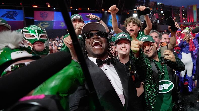 Texas Tech linebacker David Bailey poses with fans after being chosen by the New York Jets with the second overall pick during the first round of the NFL football draft, Thursday, April 23, 2026, in Pittsburgh. (AP Photo/Sue Ogrocki)