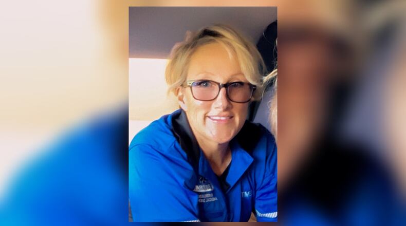 Gina Ayres, an EMT, was killed in a crash Thursday morning in Forsyth County.