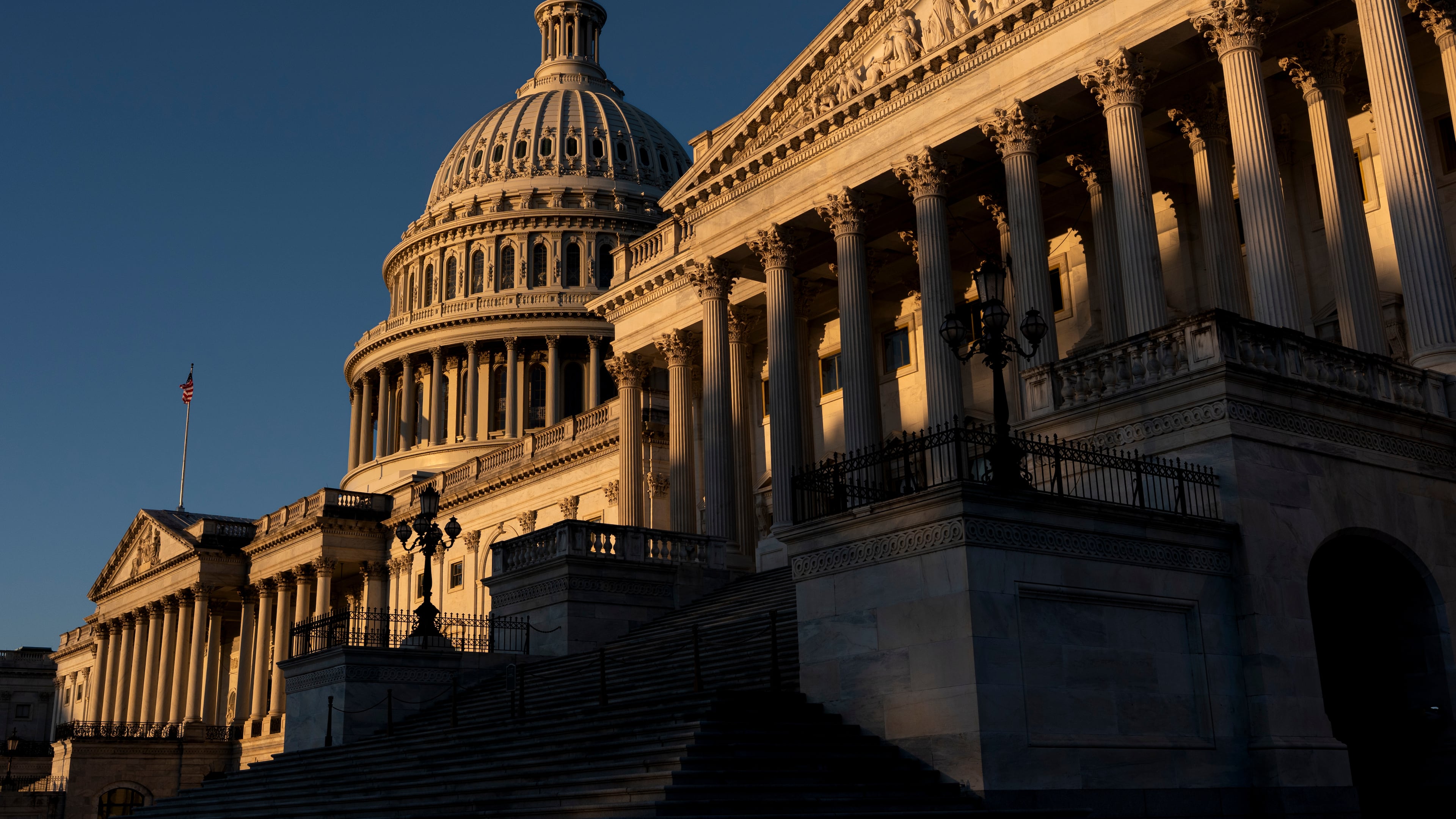 The Senate side of the Capitol is illuminated by the sun at dawn in Washington, Monday, Oct. 6, 2025. (AP Photo/J. Scott Applewhite)
