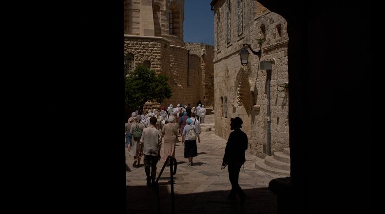 FILE - Christian pilgrims walk past the site where a nun was attacked by a man last Wednesday, after visiting the Cenacle, traditionally believed to be the site of the Last Supper, in Jerusalem, Friday, May 1, 2026. (AP Photo/Leo Correa, File)