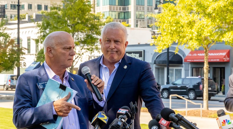 Buckhead City supporters, including state Sen. Brandon Beach, left and Bill White say violent rime is the reason they are pressing to turn the wealthy neighborhood in Atlanta into its own city. (Jenni Girtman for The Atlanta Journal-Constitution)
