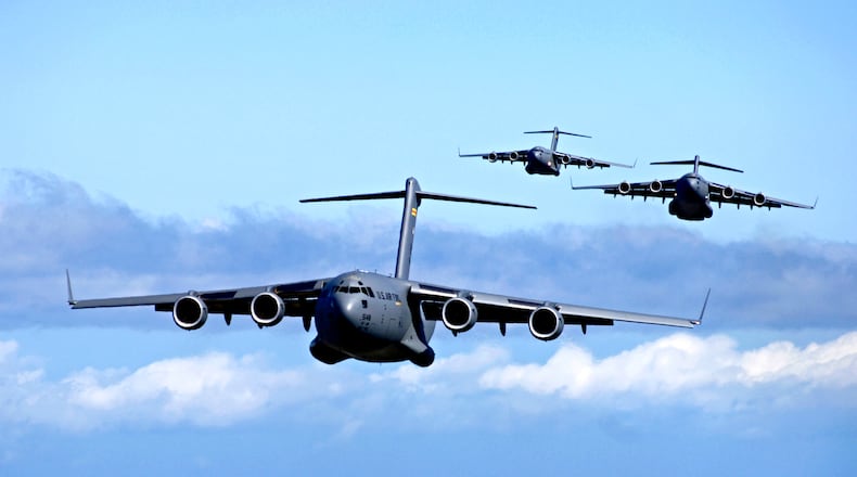 This image provided by the US Air Force shows C-17 Globemasters from the 535th Airlift Squadron, Hickam Air Force Base, Hawaii participating in an airdrop training mission May 16, 2006. A Macon Boeing plant was once part of the program. That plant, which had been slated to covert into a commercial aviation facility, will now close at the end of the year. (AP Photo/US Air Force - Tech. Sgt. Shane A. Cuomo)