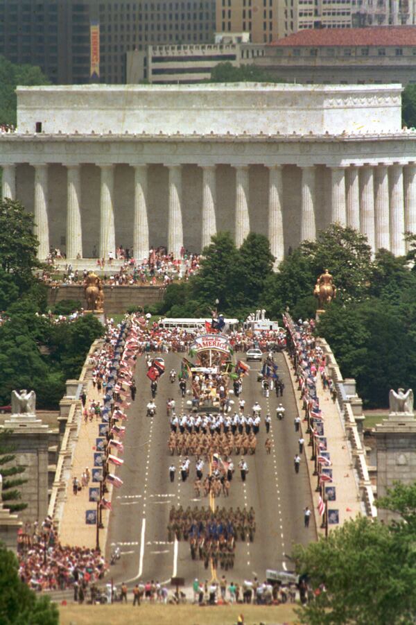FILE - This view, taken from Arlington National Cemetery, shows troops marching across the Memorial Bridge, with the Lincoln Memorial in the background, in Washington, heading towards the Pentagon during the National Victory Day Parade, June 8, 1991. The celebration to honor Gulf War troops drew an estimated 800,000 spectators. (AP Photo/Greg Gibson, File)
