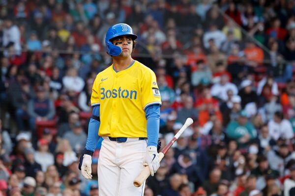 Boston Red Sox third baseman Marcelo Mayer reacts after being called out on strikes in his first major league at bat during the second inning of the second baseball game of a doubleheader against the Baltimore Orioles, Saturday, May 24, 2025, at Fenway Park in Boston. (AP Photo/Mary Schwalm)
