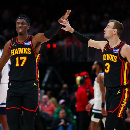 Atlanta Hawks forward Onyeka Okongwu high-fives guard Luke Kennard during the second half of an NBA basketball game against the Minnesota Timberwolves, Wednesday, Dec. 31, 2025, in Atlanta. (Colin Hubbard/AP)