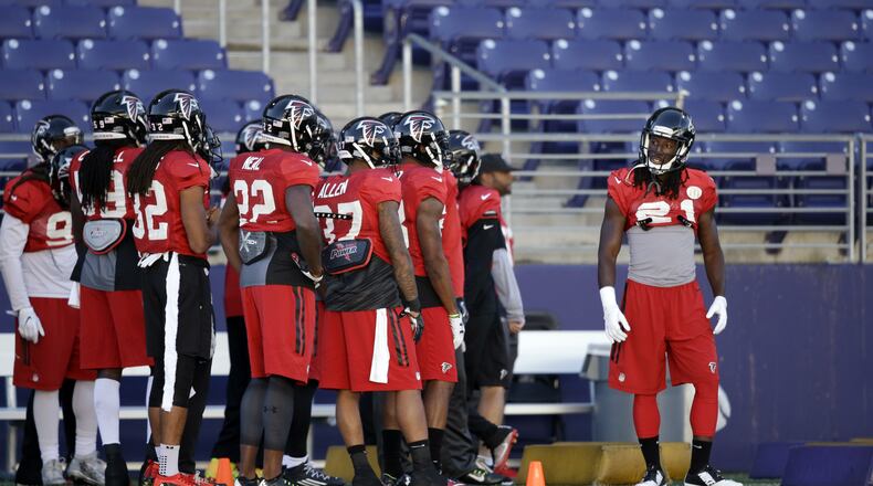 Atlanta Falcons’ Desmond Trufant, right, stands with teammates during a practice at the University of Washington Wednesday, Oct. 12, 2016, in Seattle. Trufant played college football at the school. Rather than head home, the team traveled directly to Seattle after their football game Sunday in Denver, ahead of playing the Seattle Seahawks this coming Sunday, Oct. 16, in Seattle. (AP Photo/Elaine Thompson)