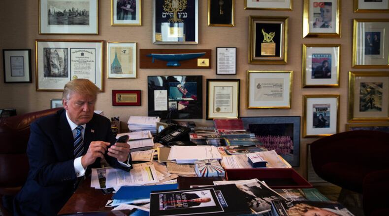 Donald Trump demonstrated last year how he posts to Twitter using his Samsung phone. PHOTO BY: Josh Haner/The New York Times