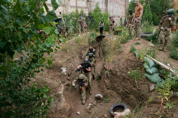 Ukrainian 3rd Assault Brigade recruits train at the polygon in Kyiv region, Ukraine, on Wednesday, July 16, 2025. (AP Photo/Evgeniy Maloletka)