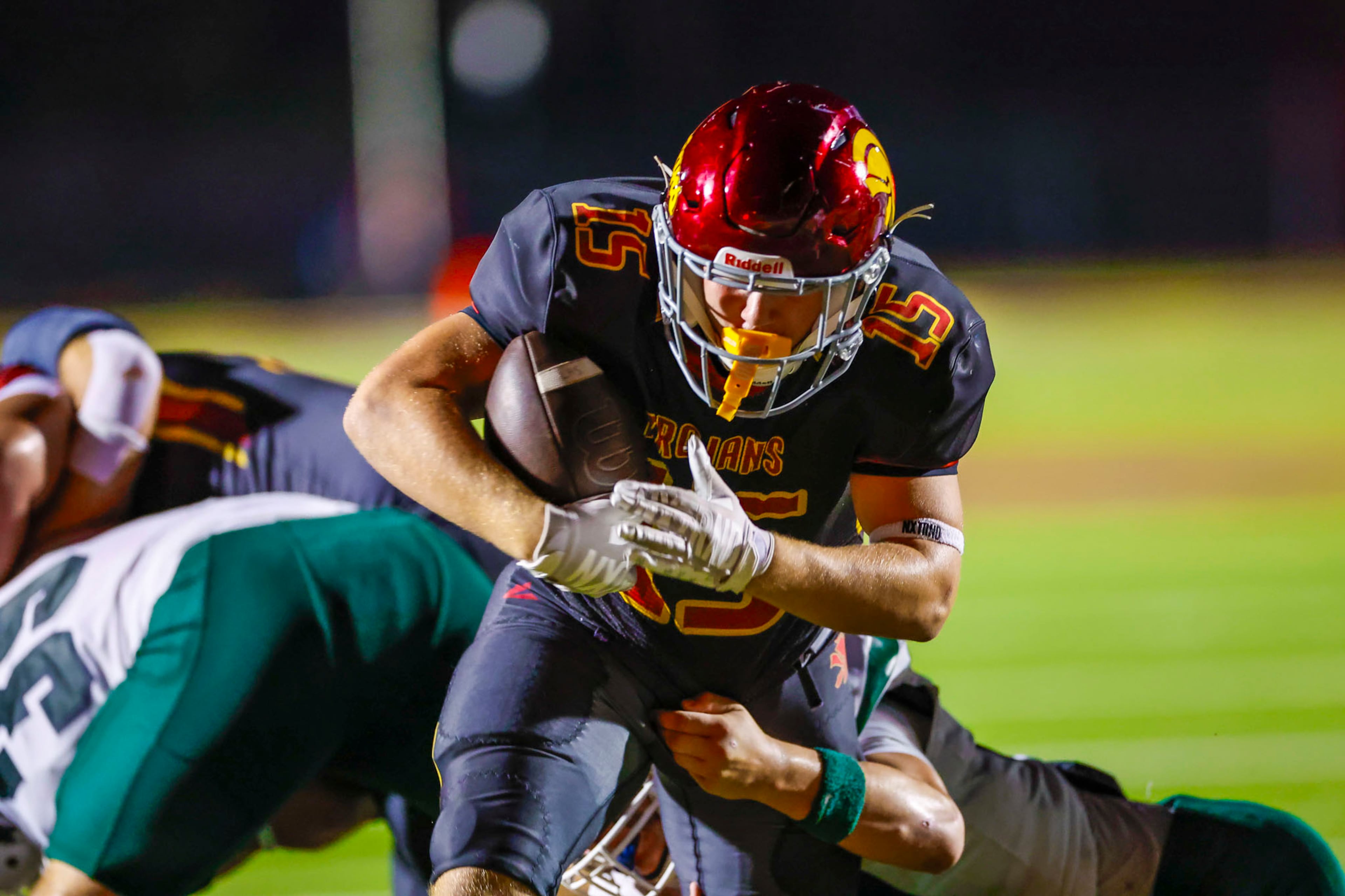 Lassiter running back Brick Bruner (#15) gets tackled during the second half against Creekview at Lassiter High School in Marietta, GA on Friday, Sept. 5, 2025. (Oscar Guevara Saenz/For the Atlanta Journal Constitution)
