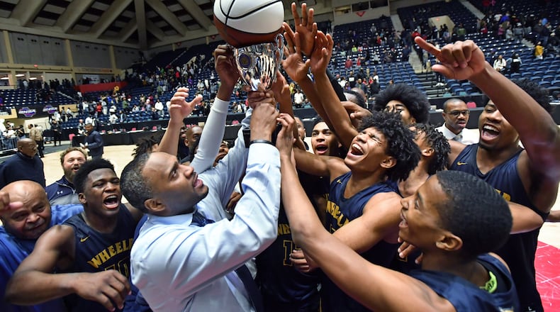 Wheeler's head coach Larry Thompson and players celebrate their dramatic victory over Grayson during 2020 GHSA State Basketball Class Championship game at the Macon Centreplex in Macon on Saturday, March 7, 2020. Wheeler won 60-59 over Grayson. (Hyosub Shin / Hyosub.Shin@ajc.com)