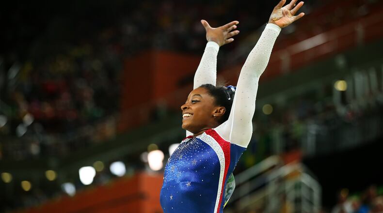 RIO DE JANEIRO, BRAZIL - AUGUST 11: Simone Biles of the United States reacts after competing on the balance beam during the Women's Individual All Around Final on Day 6 of the 2016 Rio Olympics at Rio Olympic Arena on August 11, 2016 in Rio de Janeiro, Brazil. (Photo by Alex Livesey/Getty Images)