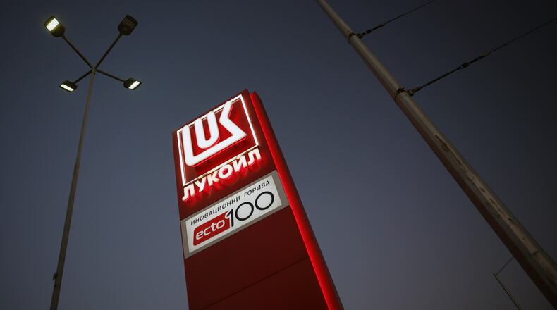A logo of a Lukoil petrol station is illuminated in Sofia, Bulgaria, Tuesday, Oct. 28, 2025. (AP Photo/ Valentina Petrova)