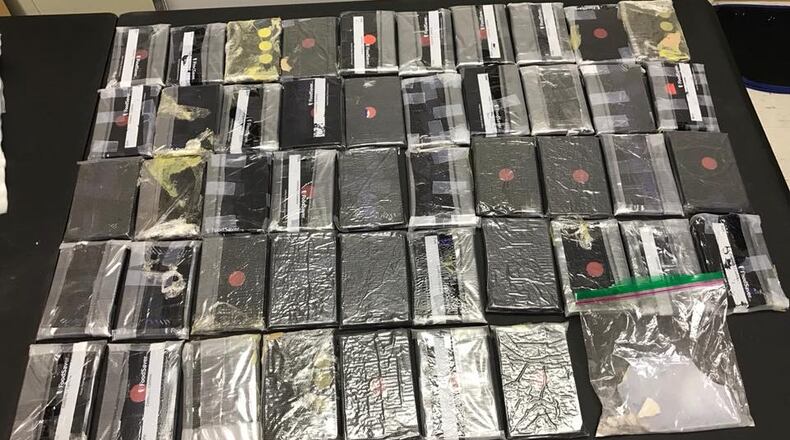 Two people are in custody after about 10 pounds of heroin was seized.