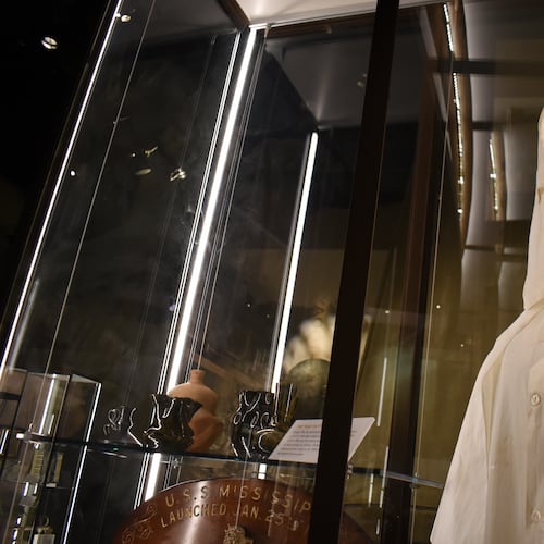 A Ku Klux Klan mask stares out over the Mississippi Museum of History on Friday, March 27, 2026, in Jackson, Miss. (AP Photo/Sophie Bates)