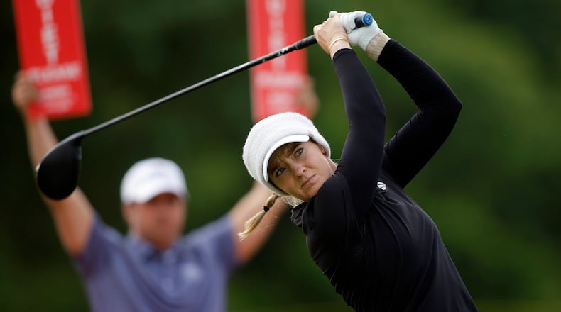 Cassie Porter, of Australia, watches her tee shot on the ninth hole during the first round of the Meijer LPGA Classic golf tournament, Thursday, June 18, 2026, in Belmont, Mich. (AP Photo/Al Goldis)