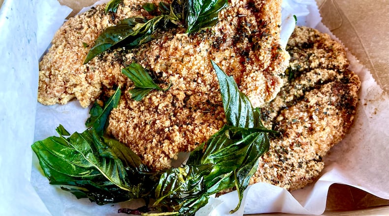 The jipai at Java Saga achieves the perfect balance of crackly crust and tender juicy meat. (Angela Hansberger for The Atlanta Journal-Constitution)