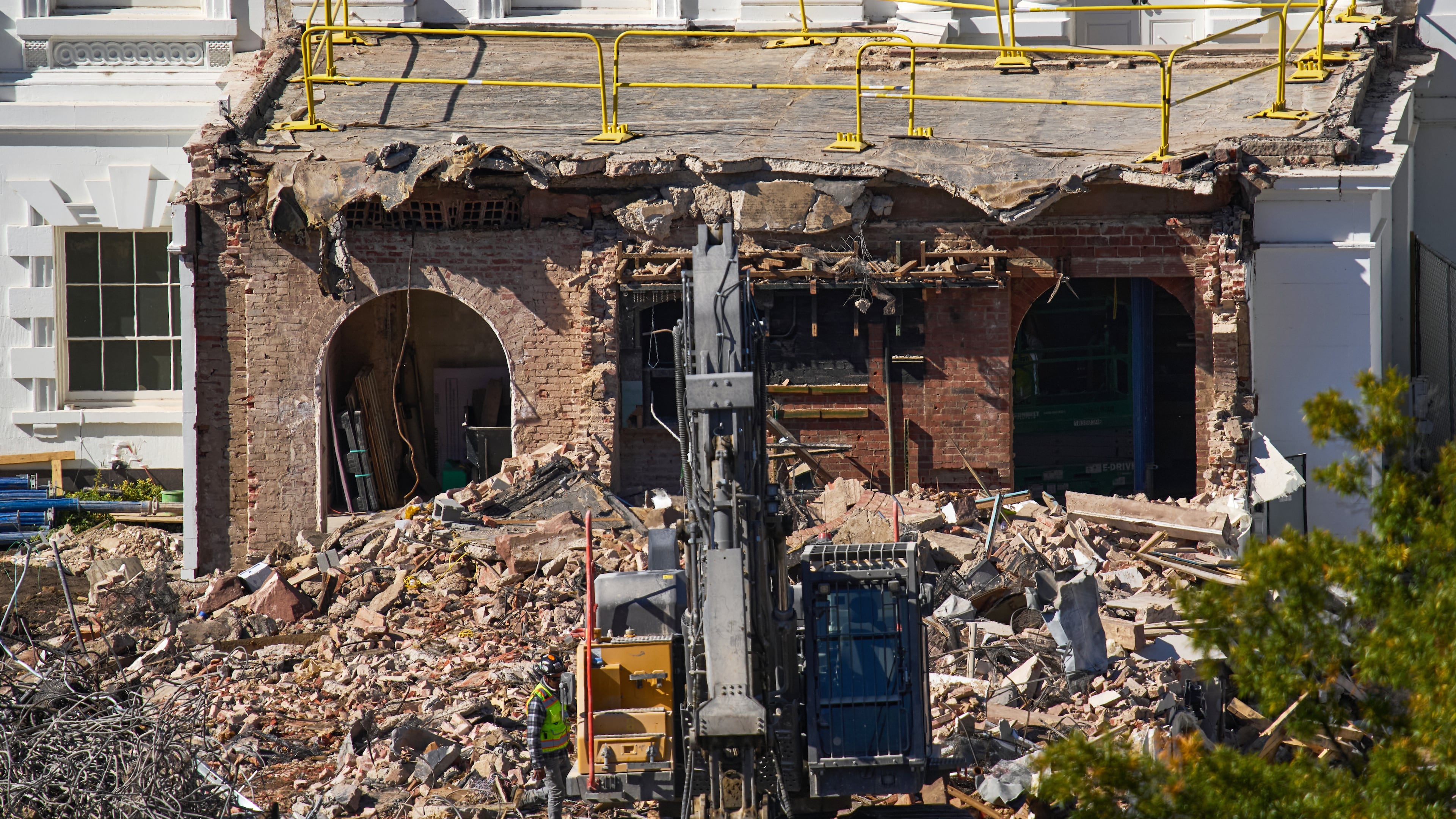 FILE - A worker walks among debris from a largely demolished part of the East Wing of the White House, Oct. 23, 2025, in Washington, before construction of a new ballroom. (AP Photo/Jacquelyn Martin)