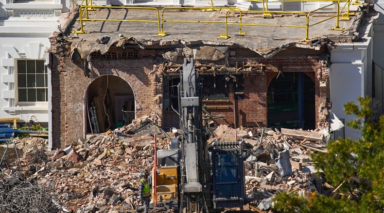 FILE - A worker walks among debris from a largely demolished part of the East Wing of the White House, Oct. 23, 2025, in Washington, before construction of a new ballroom. (AP Photo/Jacquelyn Martin)