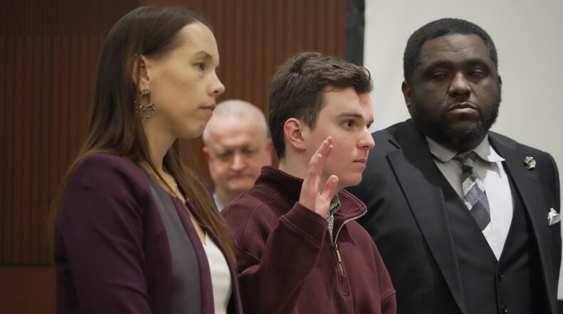 Austin Thompson is sworn in during a hearing in Wake County Superior Court on Wednesday, Jan. 21, 2026, in Raleigh, N.C. (AP Photo/Allen G. Breed)
