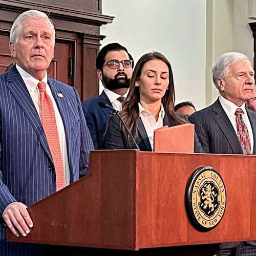 FILE - Nassau County Executive Bruce Blakeman, at podium, speaks during a news conference in Mineola, N.Y., March 6, 2024. (AP Photo/Philip Marcelo, File)