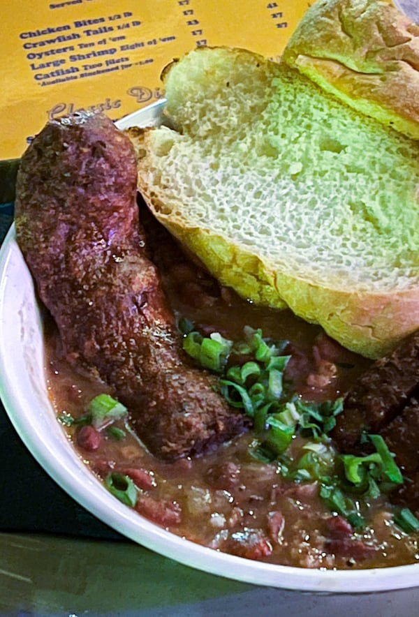 You can get sausage, beans and rice in a bowl at Bon Ton. (Henri Hollis/AJC)