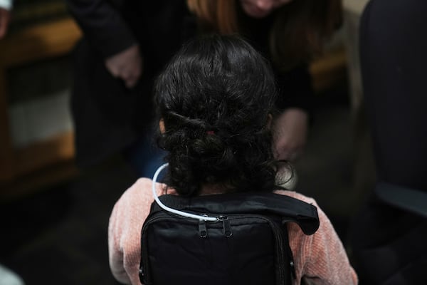 A 4-year-old Mexican girl, who has short bowel syndrome, wears a backpack carrying her medical device at a news conference in Los Angeles, Wednesday, May 28, 2025, after her and her mother's humanitarian parole was terminated and they were ordered to self-deport. (AP Photo/Jae C. Hong)