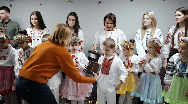 Olga Gorman (front) with a children's choir in Ukraine.